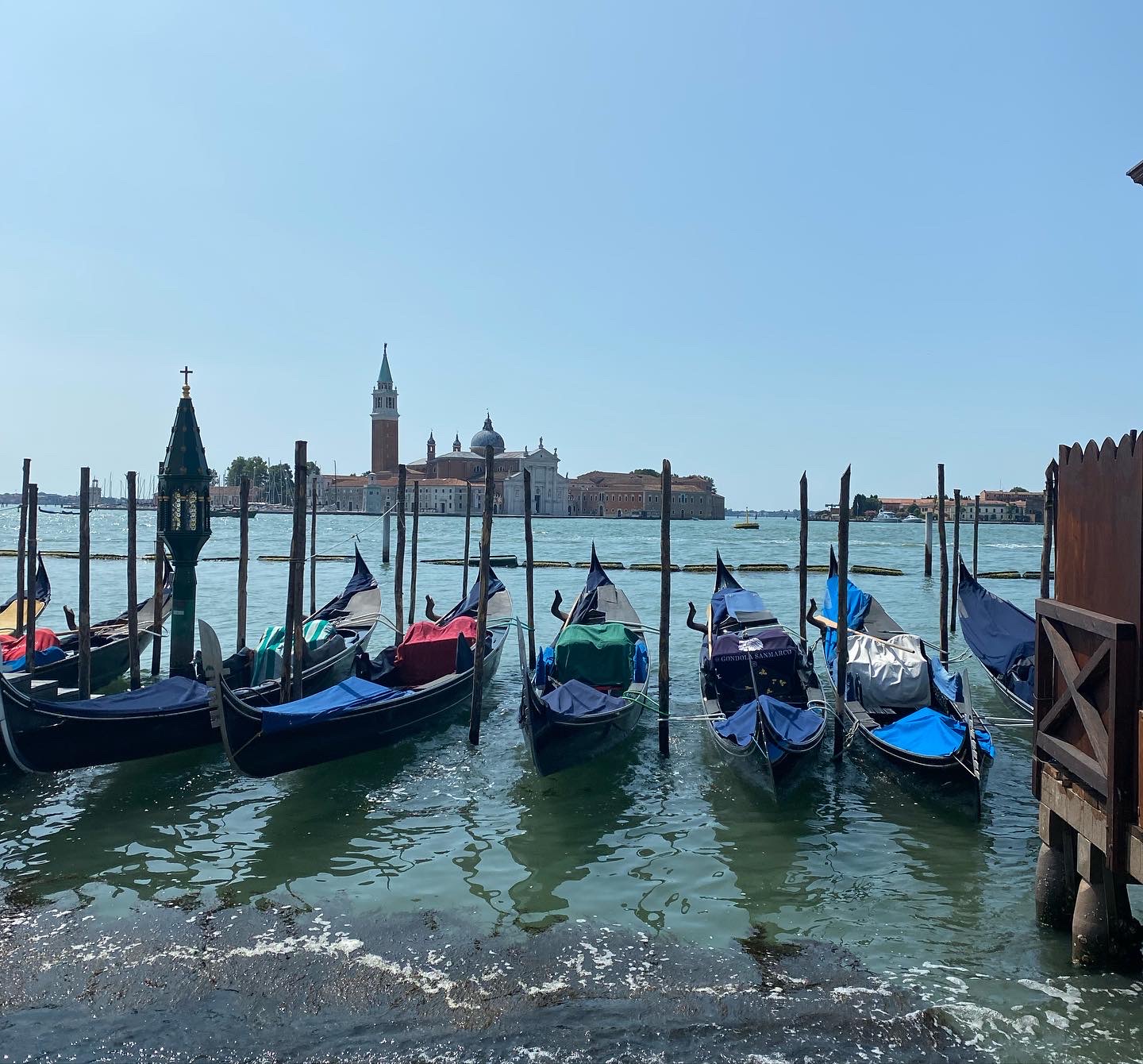 Moored gondolas with San Giorgio Maggiore island in the background